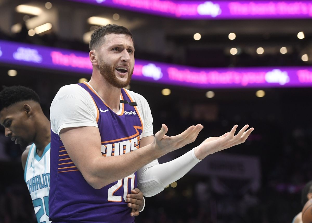 Jan 7, 2025; Charlotte, North Carolina, USA;  Phoenix Suns center Jusuf Nurkic (20) reacts after being called on a foul during the second half against the Charlotte Hornets at the Spectrum Center. Mandatory Credit: Sam Sharpe-Imagn Images