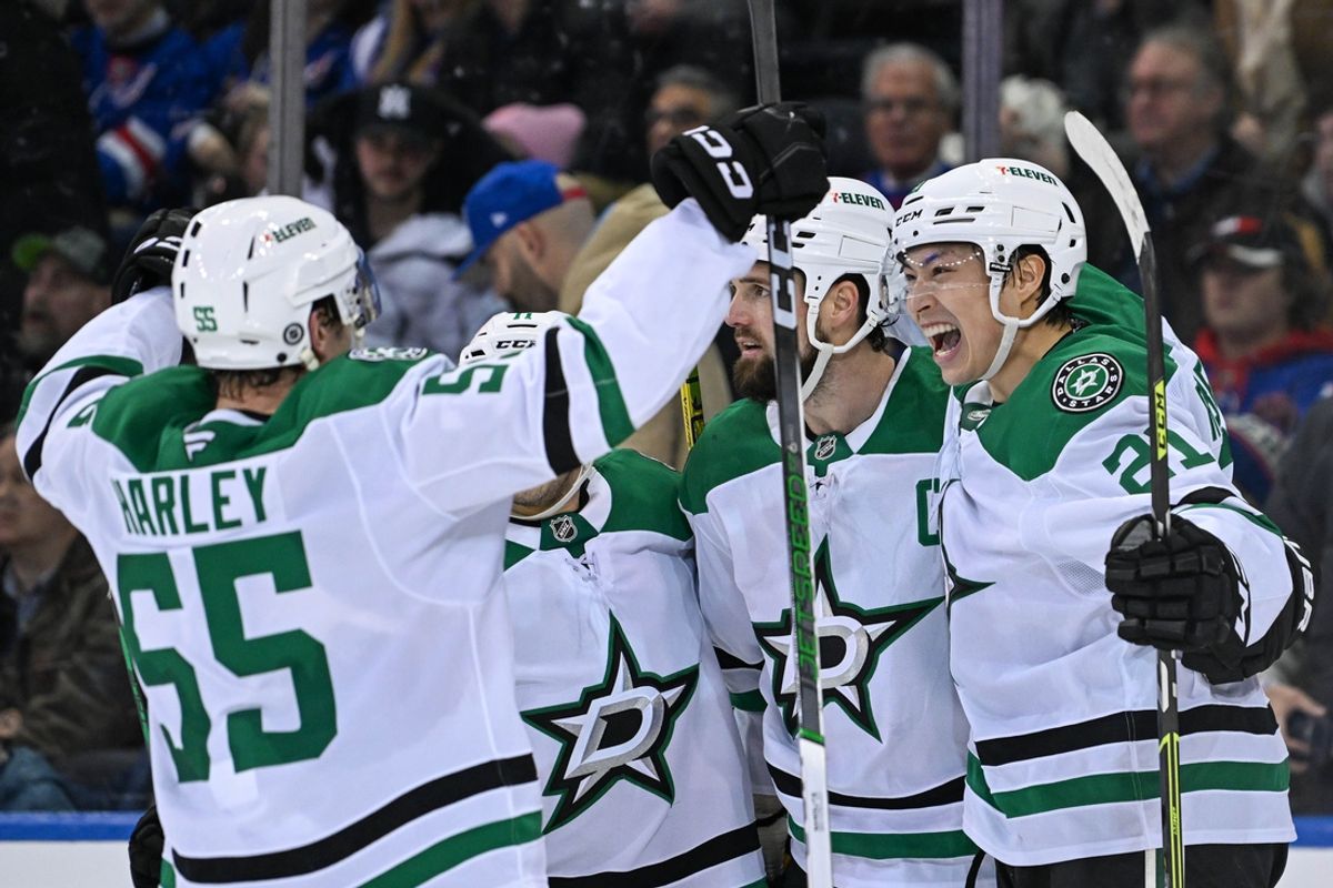 Jan 7, 2025; New York, New York, USA;  Dallas Stars left wing Jason Robertson (21) and Dallas Stars defenseman Thomas Harley (55) celebrate the game winning goal against the New York Rangers by Dallas Stars left wing Jamie Benn (14) during the overtime period at Madison Square Garden. Mandatory Credit: Dennis Schneidler-Imagn Images