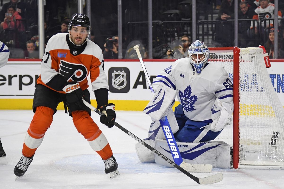 Jan 7, 2025; Philadelphia, Pennsylvania, USA; Philadelphia Flyers left wing Noah Cates (27) and Toronto Maple Leafs goaltender Joseph Woll (60) during the third period at Wells Fargo Center. Mandatory Credit: Eric Hartline-Imagn Images