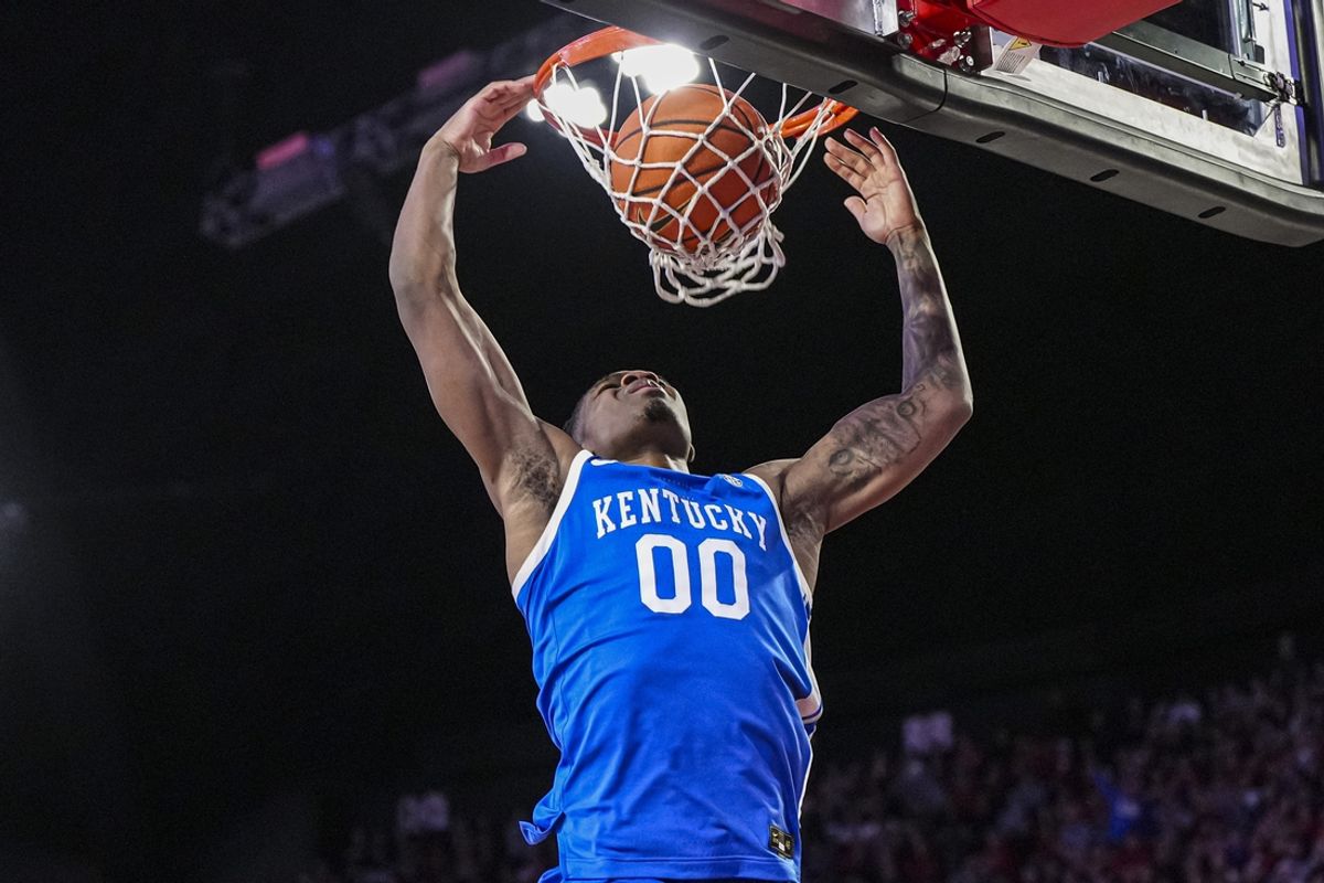 Jan 7, 2025; Athens, Georgia, USA; Kentucky Wildcats guard Otega Oweh (00) dunks against the Georgia Bulldogs during the second half at Stegeman Coliseum. Mandatory Credit: Dale Zanine-Imagn Images