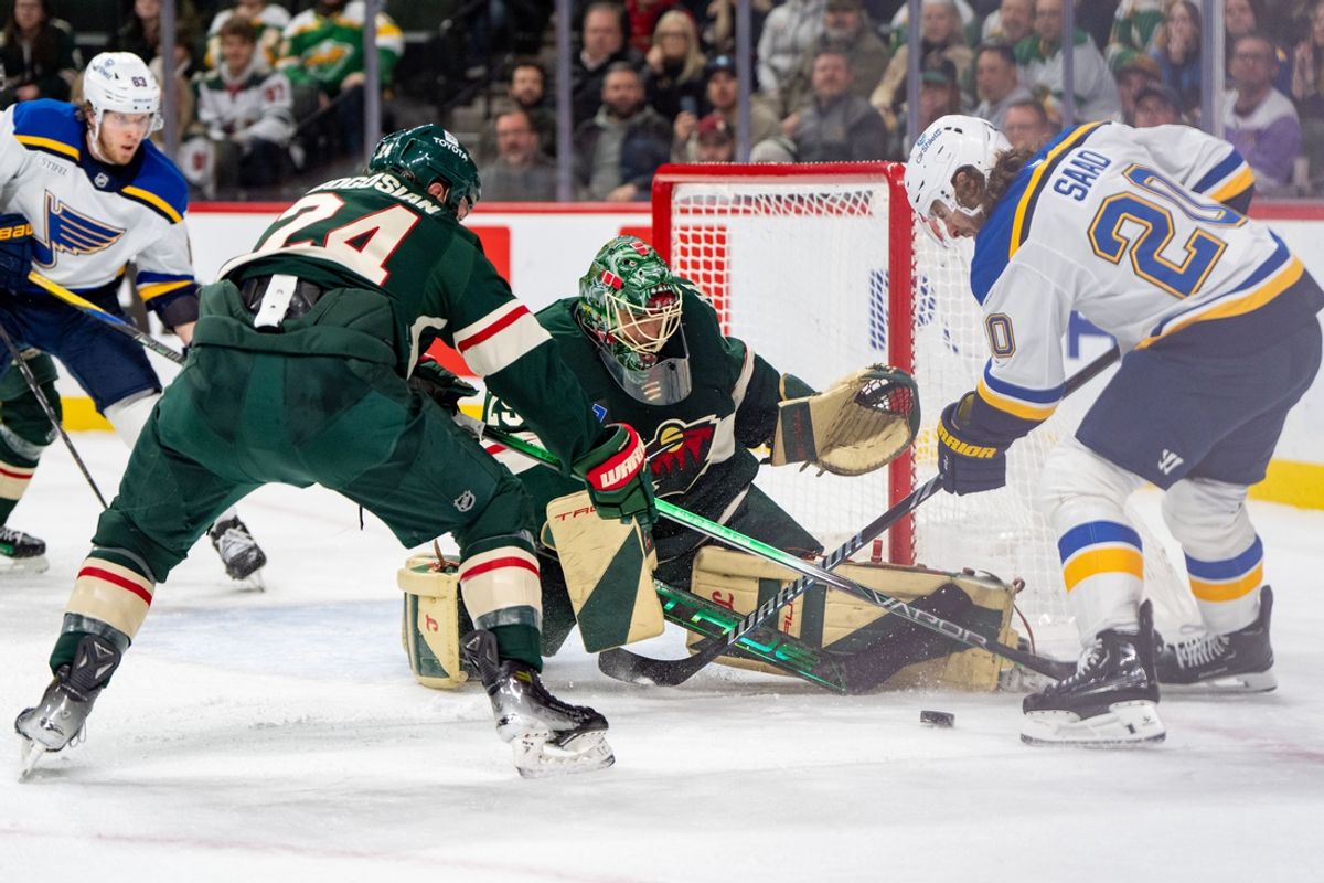 Jan 7, 2025; Saint Paul, Minnesota, USA; St. Louis Blues left wing Brandon Saad (20) has his shot blocked by Minnesota Wild goaltender Marc-Andre Fleury (29) and defenseman Zach Bogosian (24) in the third period at Xcel Energy Center. Mandatory Credit: Matt Blewett-Imagn Images