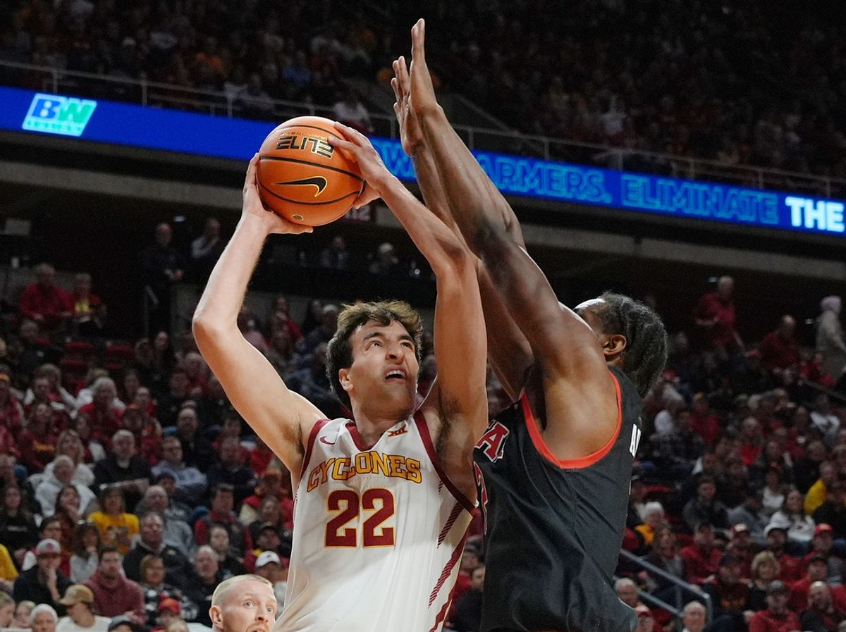 Iowa State Cyclones forward Milan Momcilovic (22) ldrives to the basket around Utah Utes forward Ezra Ausar (2) during the first half in the Big-12 men’s basketball at Hilton Coliseum on Jan. 7, 2025 in Ames, Iowa.