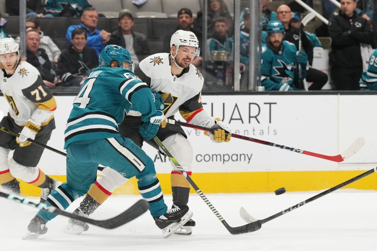 Jan 7, 2025; San Jose, California, USA; Vegas Golden Knights center Tomas Hertl (center) passes against San Jose Sharks center Mikael Granlund (center left) during the first period at SAP Center at San Jose. Mandatory Credit: Darren Yamashita-Imagn Images