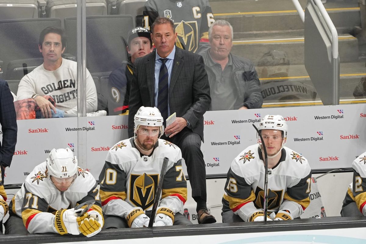 Jan 7, 2025; San Jose, California, USA; Vegas Golden Knights head coach Bruce Cassidy (center back) stands behind the bench during the third period against the San Jose Sharks at SAP Center at San Jose. Mandatory Credit: Darren Yamashita-Imagn Images