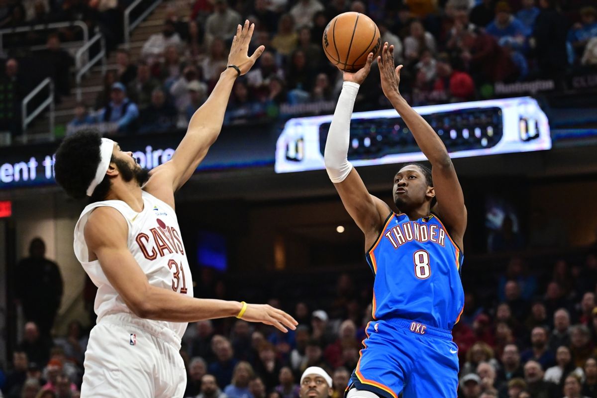Jan 8, 2025; Cleveland, Ohio, USA; Oklahoma City Thunder forward Jalen Williams (8) shoots over the defense of  Cleveland Cavaliers center Jarrett Allen (31) during the first quarter at Rocket Mortgage FieldHouse. Mandatory Credit: Ken Blaze-Imagn Images
