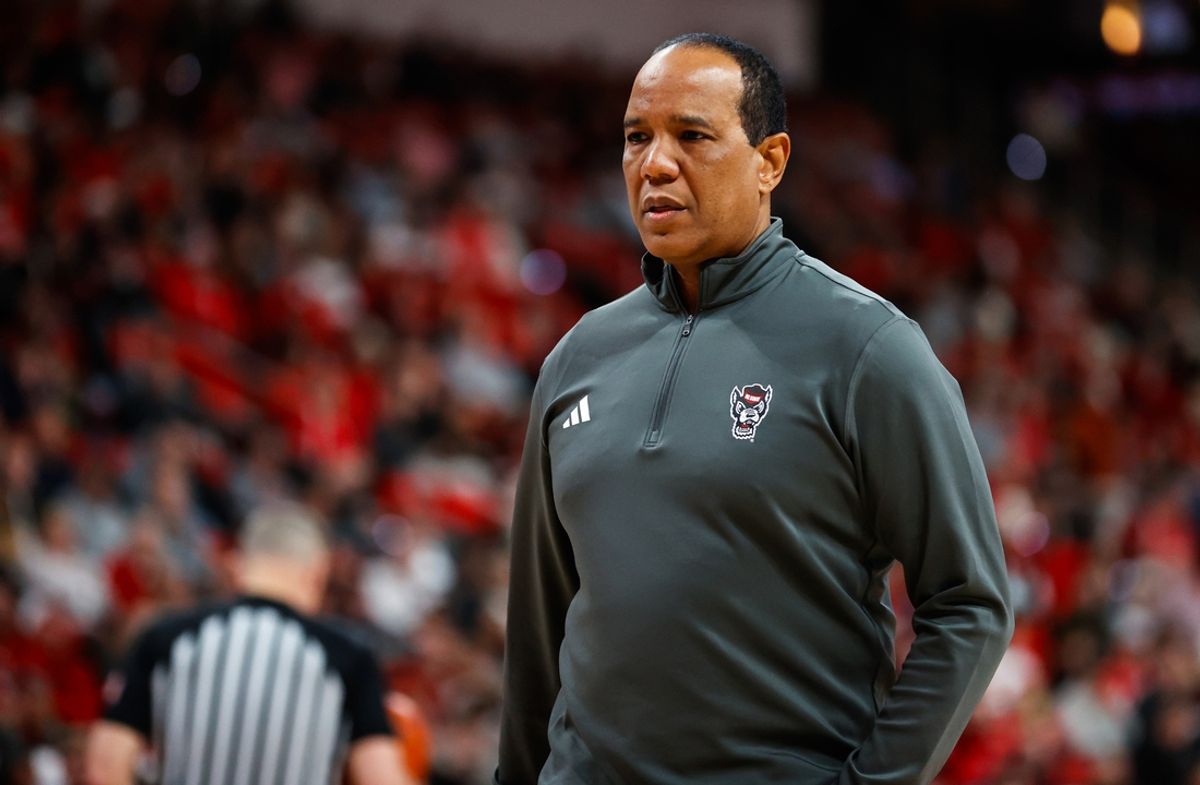 Jan 8, 2025; Raleigh, North Carolina, USA;  North Carolina State Wolfpack head coach Kevin Keatts checks on a player during the first half against the Notre Dame Fighting Irish at Lenovo Center. Mandatory Credit: Jaylynn Nash-Imagn Images