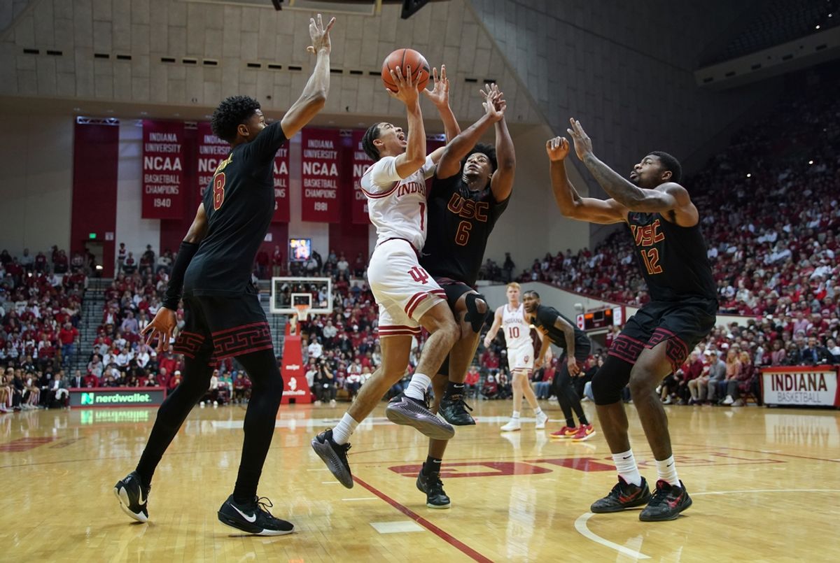 Jan 8, 2025; Bloomington, Indiana, USA; Indiana Hoosiers guard Myles Rice (1) is fouled by USC Trojans guard Wesley Yates III (6) on a drive to the basket during the first half at Simon Skjodt Assembly Hall. Mandatory Credit: Robert Goddin-Imagn Images