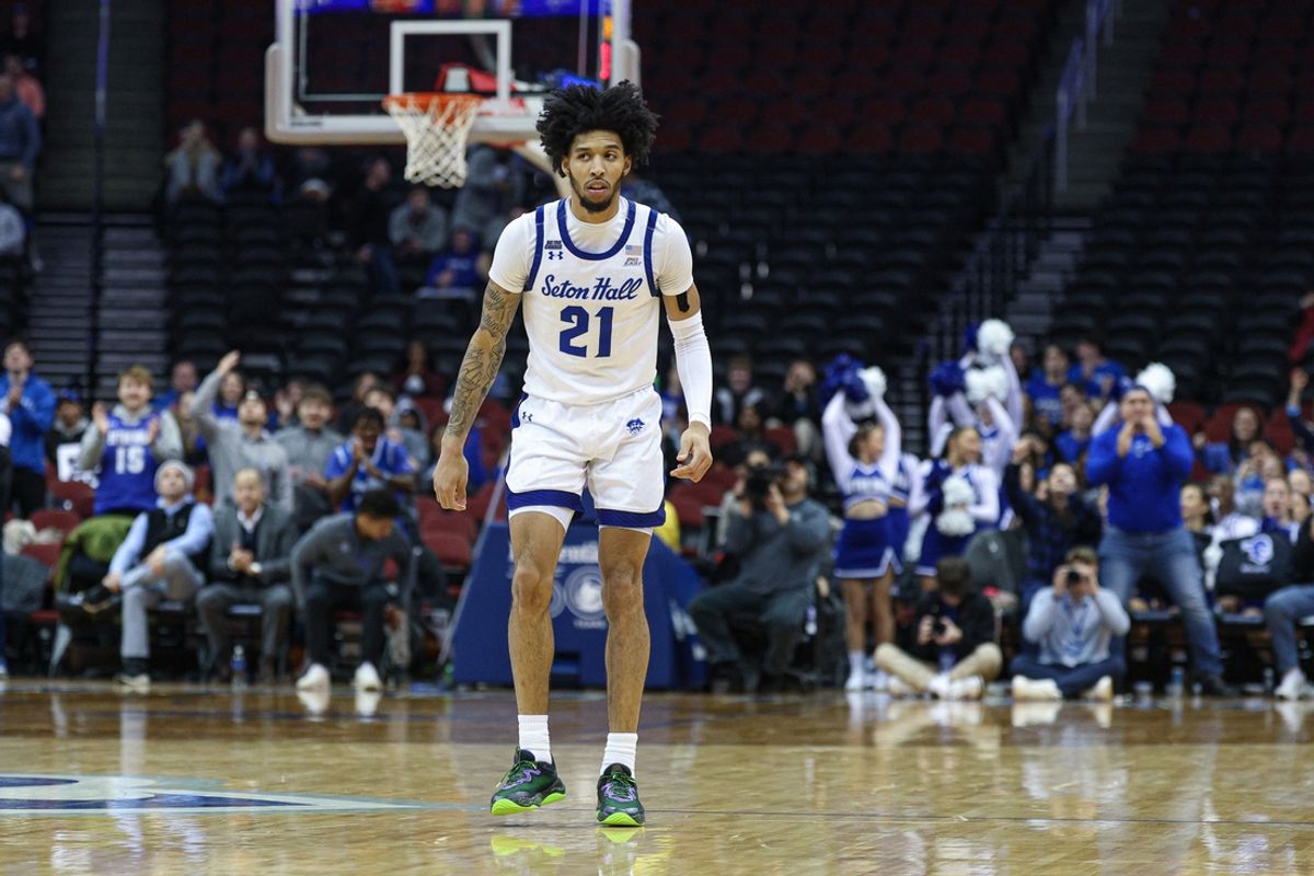 Jan 8, 2025; Newark, New Jersey, USA; Seton Hall Pirates guard Isaiah Coleman (21) reacts after makes a three point basket during the second half against the DePaul Blue Demons at Prudential Center. Mandatory Credit: Vincent Carchietta-Imagn Images
