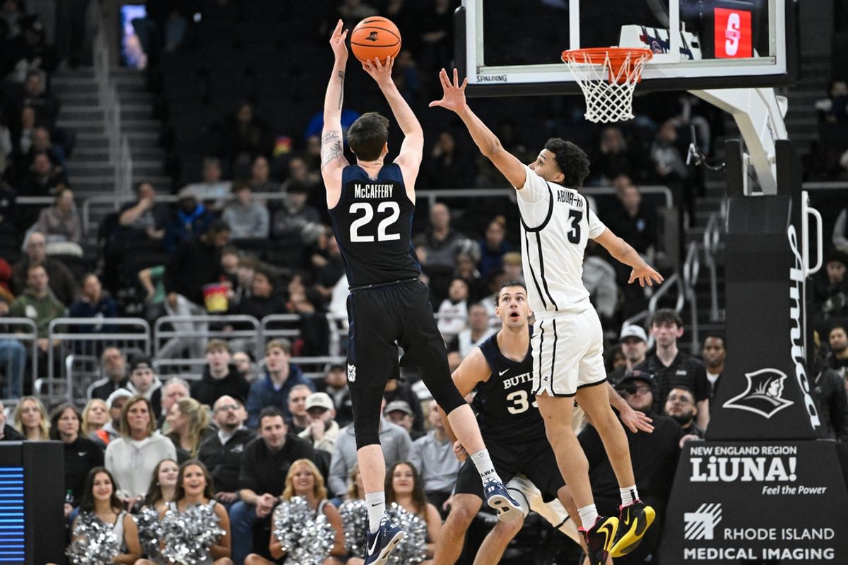 Jan 8, 2025; Providence, Rhode Island, USA; Butler Bulldogs forward Patrick McCaffery (22) shoots the ball over Providence Friars guard Jabri Abdur-Rahim (3) during the first half at Amica Mutual Pavilion. Mandatory Credit: Eric Canha-Imagn Images