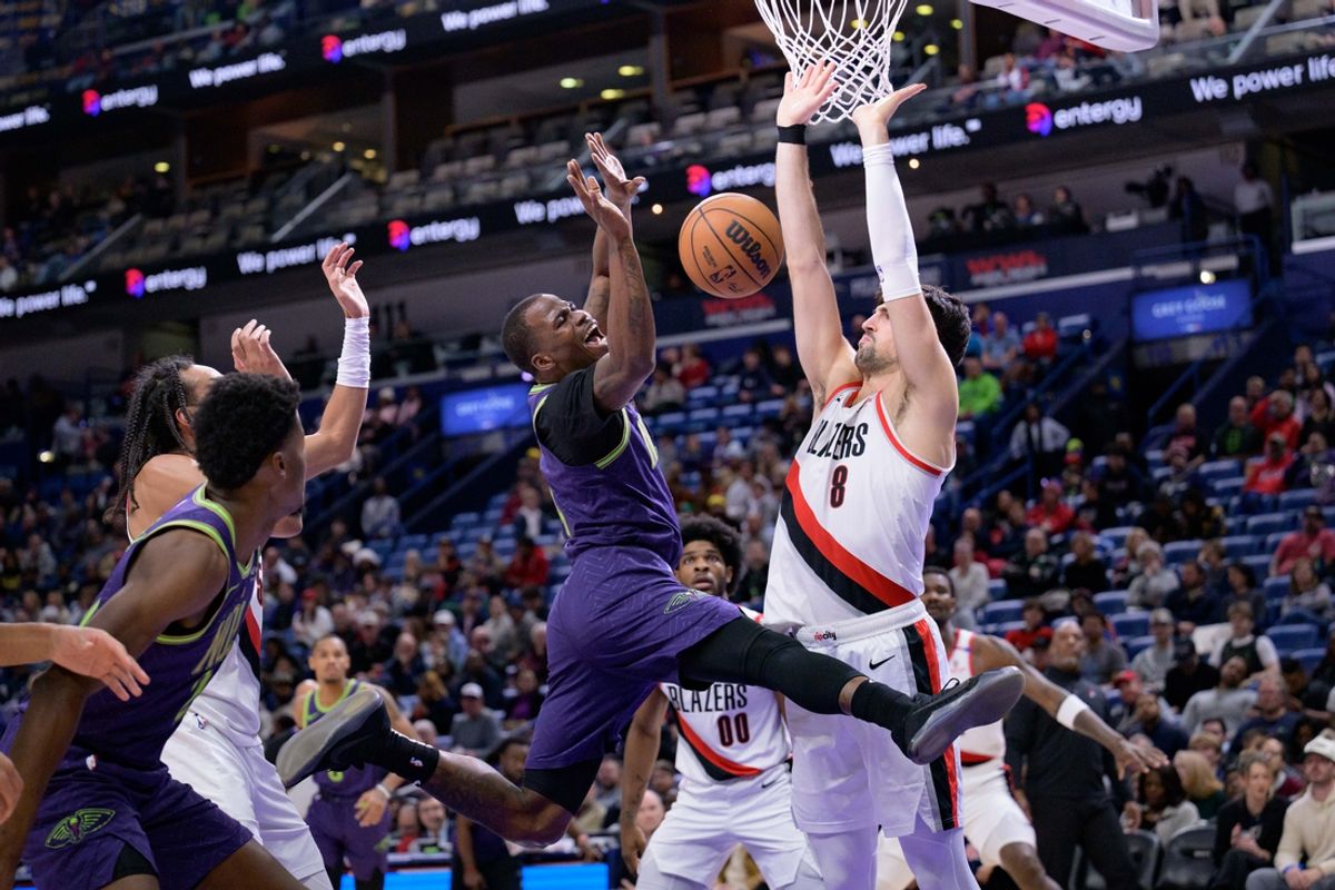 Jan 8, 2025; New Orleans, Louisiana, USA;  New Orleans Pelicans guard Javonte Green (4) looses the ball next to Portland Trail Blazers forward Deni Avdija (8) during the first half at Smoothie King Center. Mandatory Credit: Matthew Hinton-Imagn Images
