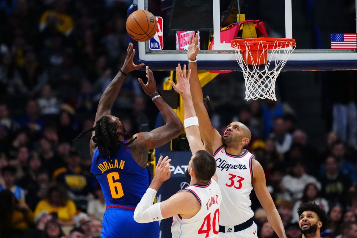 Jan 8, 2025; Denver, Colorado, USA; Denver Nuggets center DeAndre Jordan (6) shoots over LA Clippers center Ivica Zubac (40) and forward Nicolas Batum (33) in the first quarter at Ball Arena. Mandatory Credit: Ron Chenoy-Imagn Images