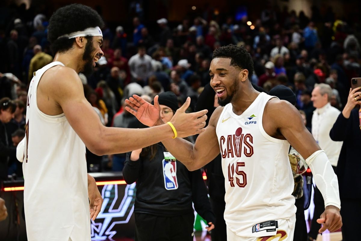 Jan 8, 2025; Cleveland, Ohio, USA; Cleveland Cavaliers guard Donovan Mitchell (45) celebrates with center Jarrett Allen (31) after the Cavaliers beat the Oklahoma City Thunder at Rocket Mortgage FieldHouse. Mandatory Credit: Ken Blaze-Imagn Images