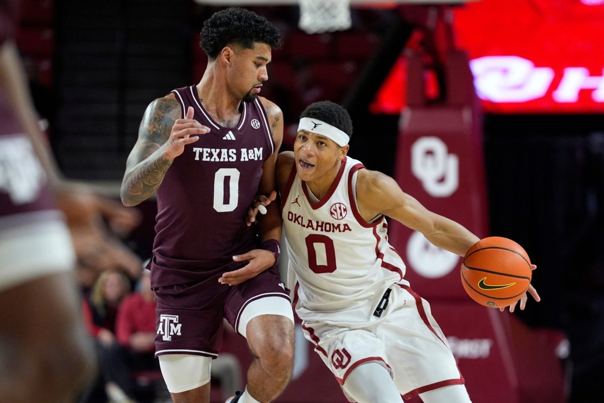 Oklahoma Sooners goes past Texas A&M Aggies guard Jace Carter (0) during an SEC men's college basketball game between the University of Oklahoma Sooners (OU) and the Texas A&M Aggies at Lloyd Noble Center in Norman, Okla., Wednesday, Jan. 8, 2025.