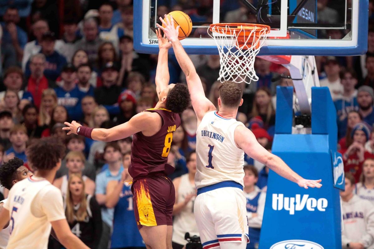 Arizona State Sun Devils forward Basheer Jihad (8) shoots against Kansas Jayhawks center Hunter Dickinson (1) in the first half of the game inside Allen Fieldhouse Wednesday, Jan. 8, 2025.
