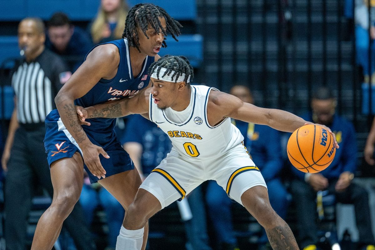 Jan 8, 2025; Berkeley, California, USA; Virginia Cavaliers guard Dai Dai Ames (7) guards against California Golden Bears guard Jeremiah Wilkinson (0) during the first half at Haas Pavilion. Mandatory Credit: Neville E. Guard-Imagn Images