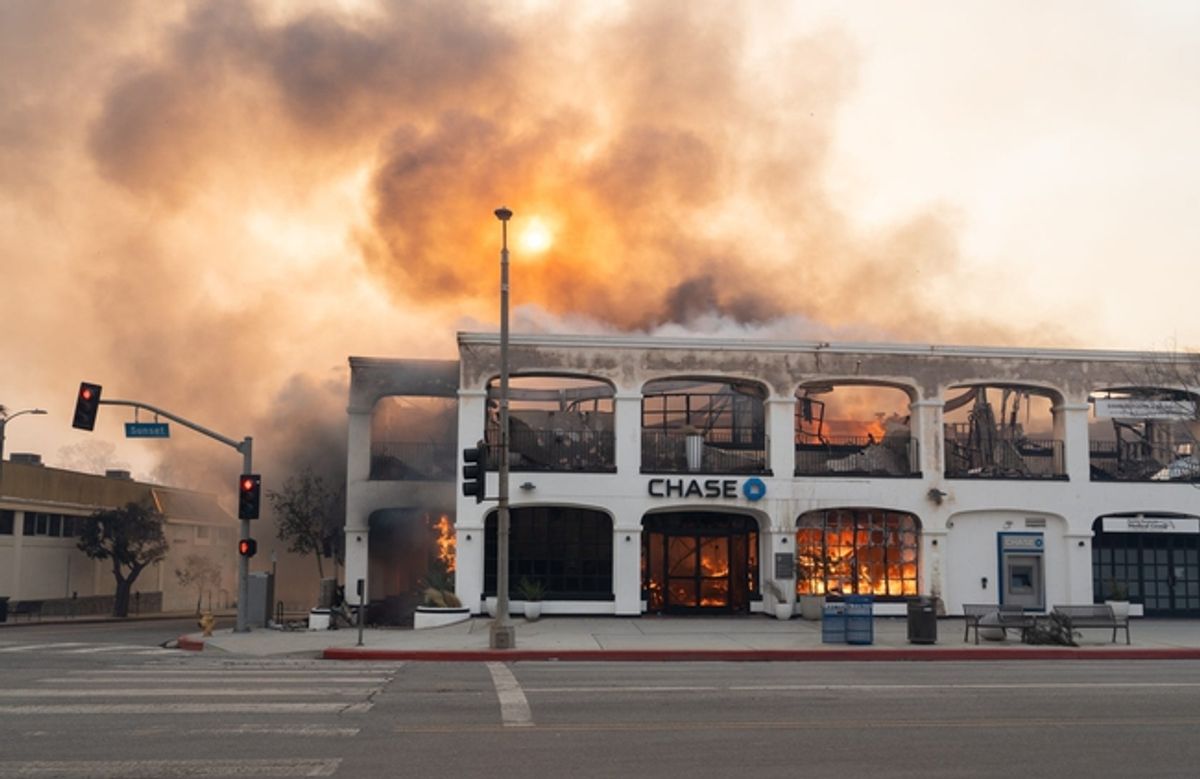 A Chase bank on Sunset Blvd. in the Pacific Palisades neighborhood burns on Jan. 8, 2025, after a wildfire broke out in Los Angeles County on Jan. 7. The fires destroyed more than 1,000 homes, businesses and other structures, Los Angeles County Fire Chief Anthony Marrone said at a briefing Wednesday.