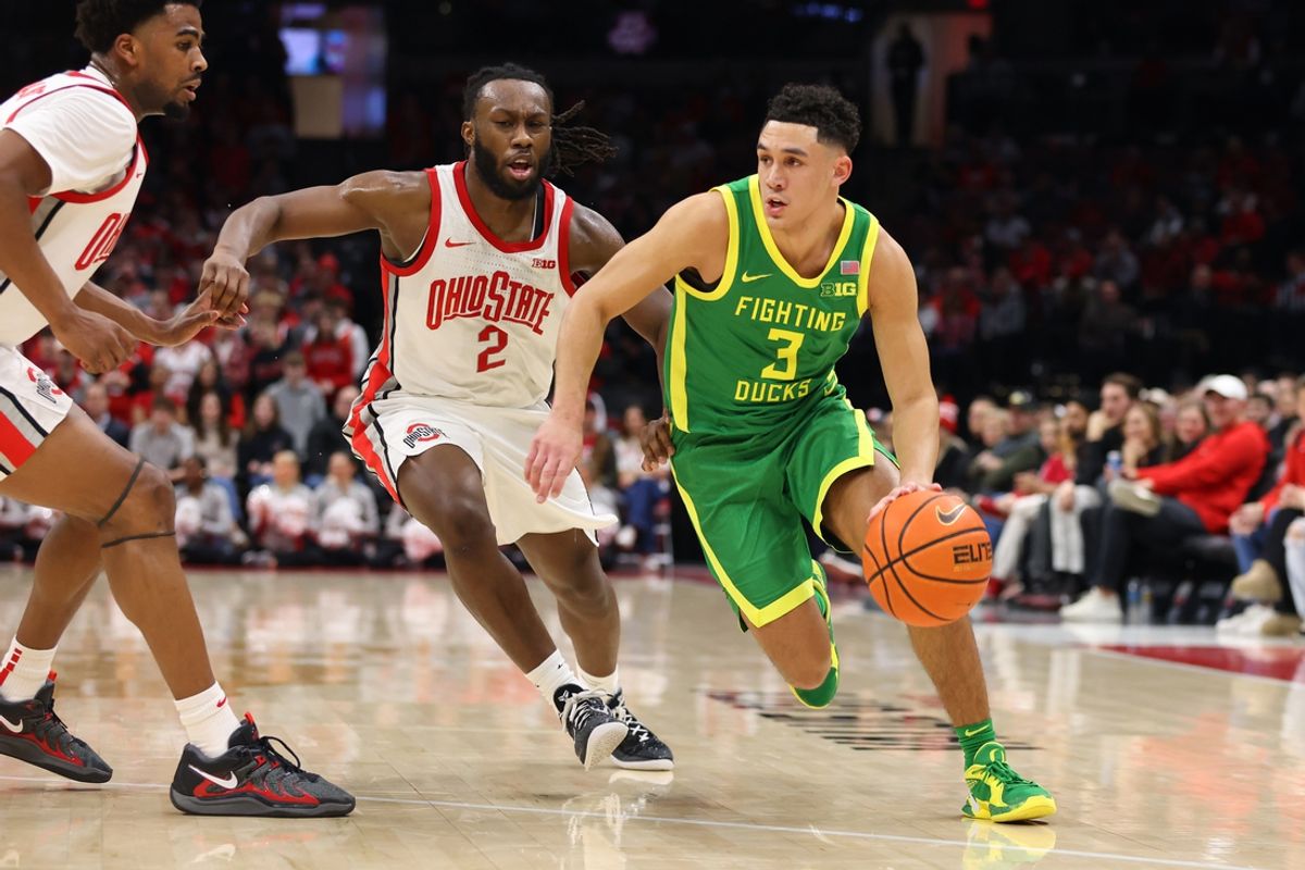 Jan 9, 2025; Columbus, Ohio, USA;  Oregon Ducks guard Jackson Shelstad (3) dribbles the ball past Ohio State Buckeyes guard Bruce Thornton (2) during the first half at Value City Arena. Mandatory Credit: Joseph Maiorana-Imagn Images