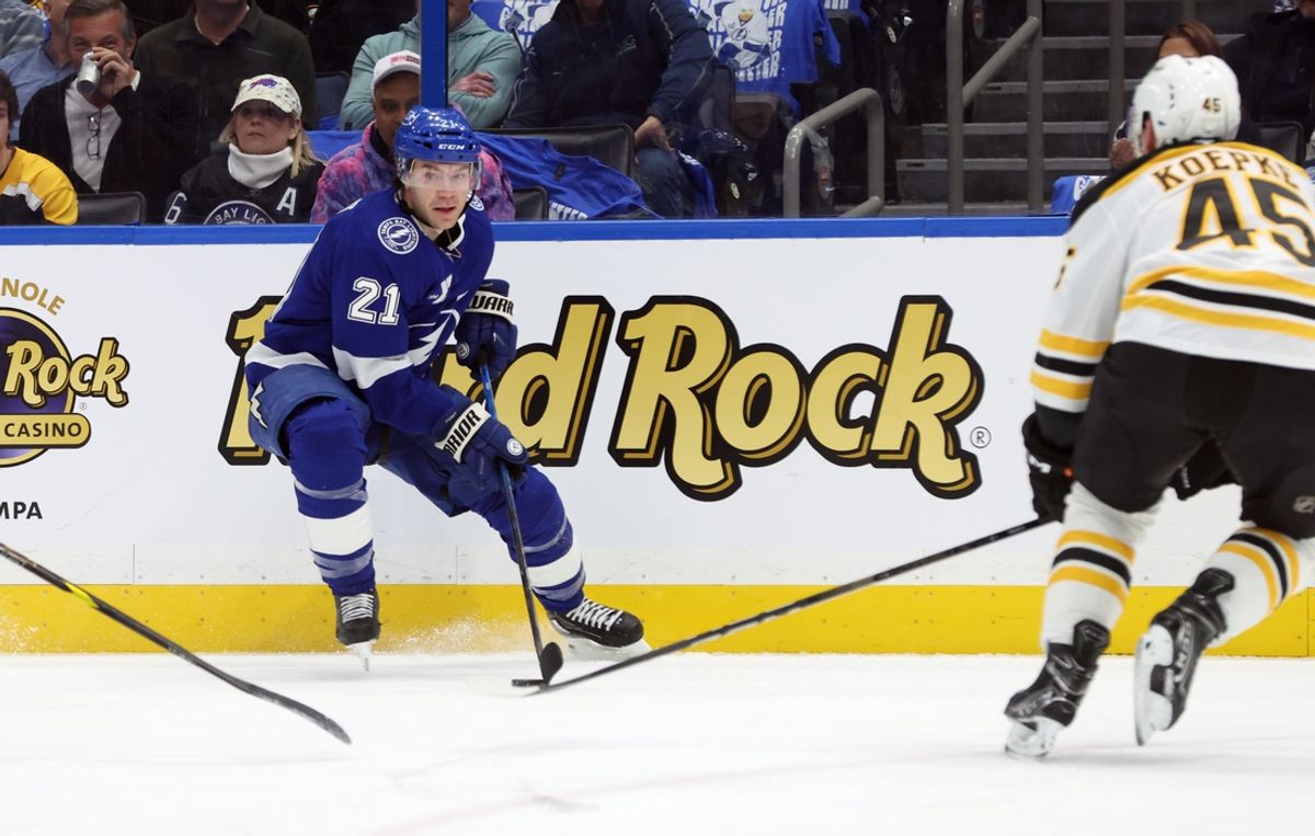 Jan 9, 2025; Tampa, Florida, USA; Tampa Bay Lightning center Brayden Point (21) skates with the puck against the Boston Bruins during the first period at Amalie Arena. Mandatory Credit: Kim Klement Neitzel-Imagn Images