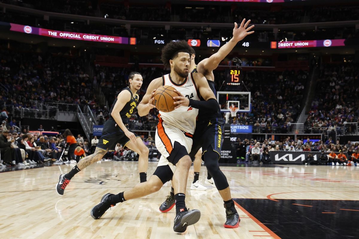 Jan 9, 2025; Detroit, Michigan, USA;  Detroit Pistons guard Cade Cunningham (2) rebound against Golden State Warriors forward Kyle Anderson (1) in the first half at Little Caesars Arena. Mandatory Credit: Rick Osentoski-Imagn Images