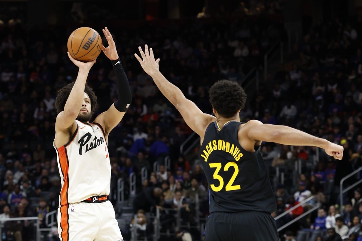 Jan 9, 2025; Detroit, Michigan, USA;  Detroit Pistons guard Cade Cunningham (2) shoots on Golden State Warriors forward Trayce Jackson-Davis (32) in the first half at Little Caesars Arena. Mandatory Credit: Rick Osentoski-Imagn Images