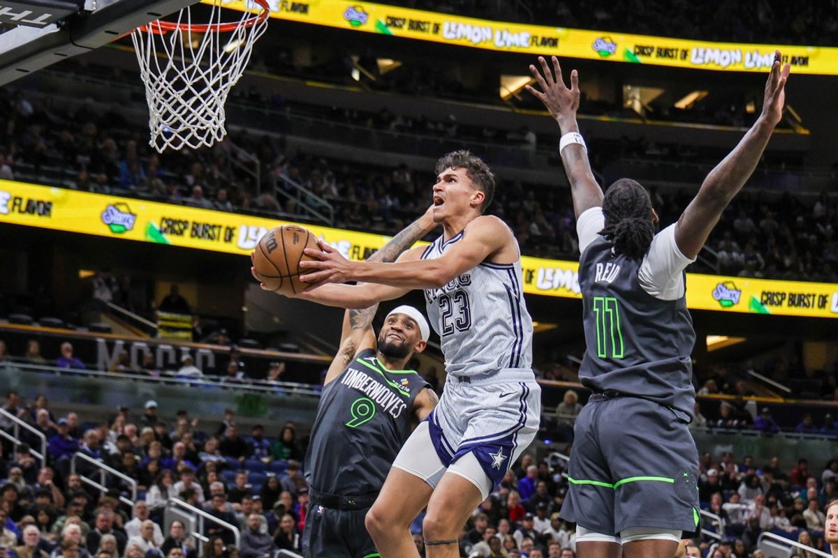 Jan 9, 2025; Orlando, Florida, USA; Orlando Magic forward Tristan da Silva (23) is fouled by Minnesota Timberwolves guard Nickeil Alexander-Walker (9) during the second quarter at Kia Center. Mandatory Credit: Mike Watters-Imagn Images