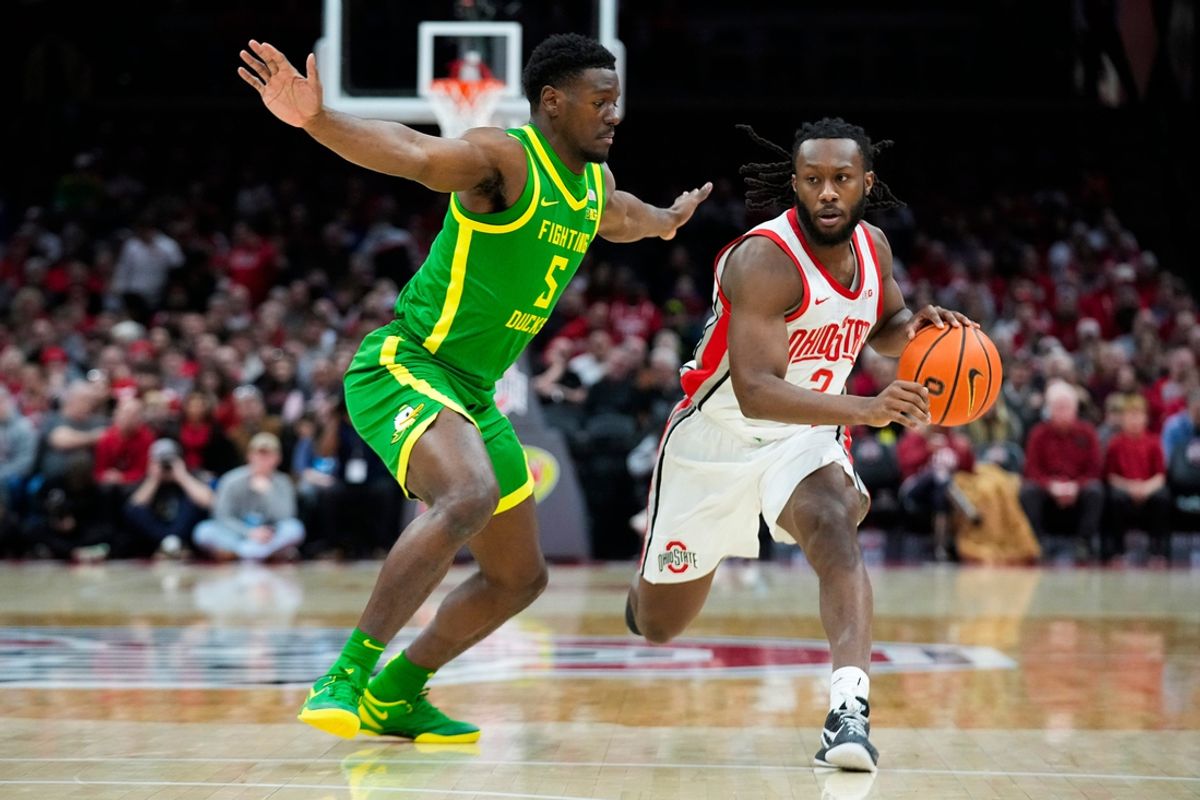 Ohio State Buckeyes guard Bruce Thornton (2) dribbles the ball against Oregon Ducks guard TJ Bamba (5) in the first half at Value City Arena on Thursday, Jan. 9, 2025 in Columbus, Ohio.