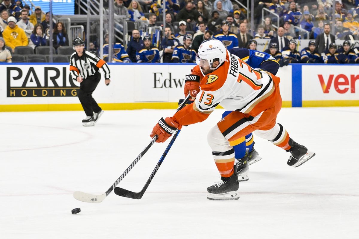 Jan 9, 2025; St. Louis, Missouri, USA;  Anaheim Ducks center Robby Fabbri (13) shoots against the St. Louis Blues during the first period at Enterprise Center. Mandatory Credit: Jeff Curry-Imagn Images