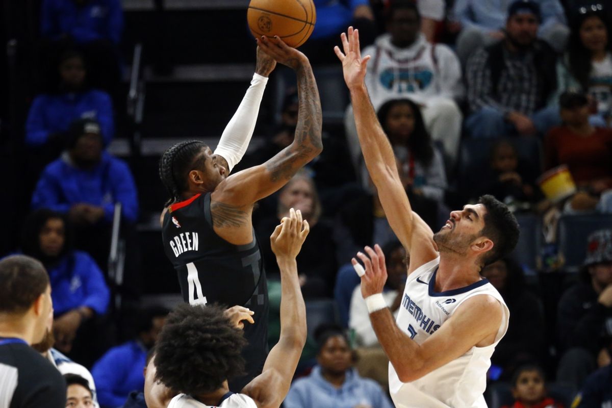 Jan 9, 2025; Memphis, Tennessee, USA; Houston Rockets guard Jalen Green (4) shoots as Memphis Grizzlies forward Santi Aldama (7) defends during the second quarter at FedExForum. Mandatory Credit: Petre Thomas-Imagn Images