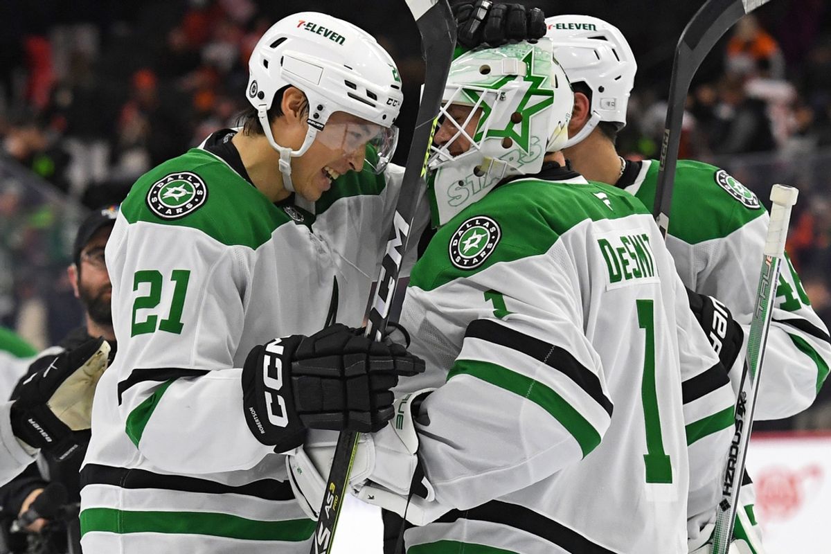 Jan 9, 2025; Philadelphia, Pennsylvania, USA; Dallas Stars left wing Jason Robertson (21) and goaltender Casey DeSmith (1) celebrate win against the Philadelphia Flyers at Wells Fargo Center. Mandatory Credit: Eric Hartline-Imagn Images