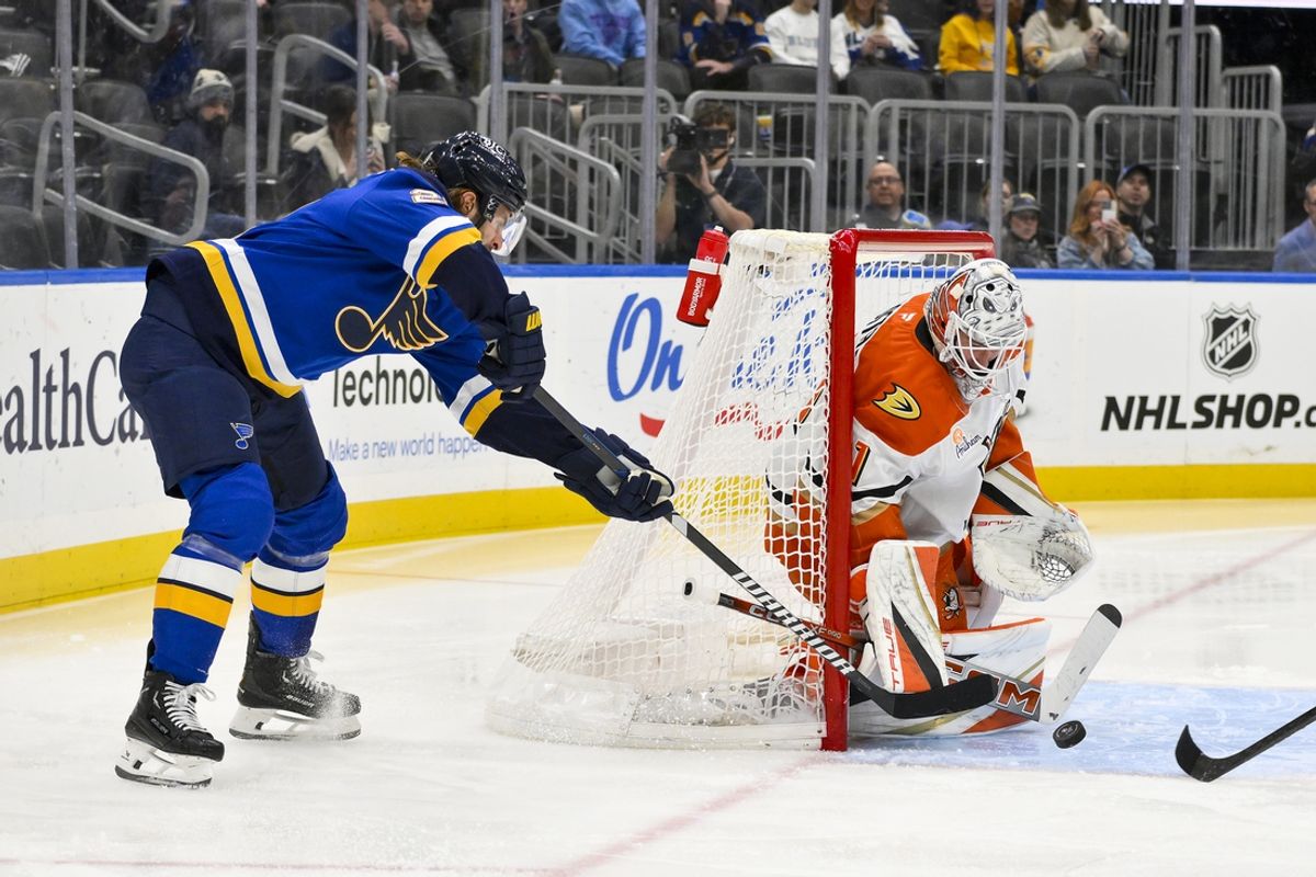 Jan 9, 2025; St. Louis, Missouri, USA;  Anaheim Ducks goaltender Lukas Dostal (1) defends the net against St. Louis Blues left wing Brandon Saad (20) during the second period at Enterprise Center. Mandatory Credit: Jeff Curry-Imagn Images