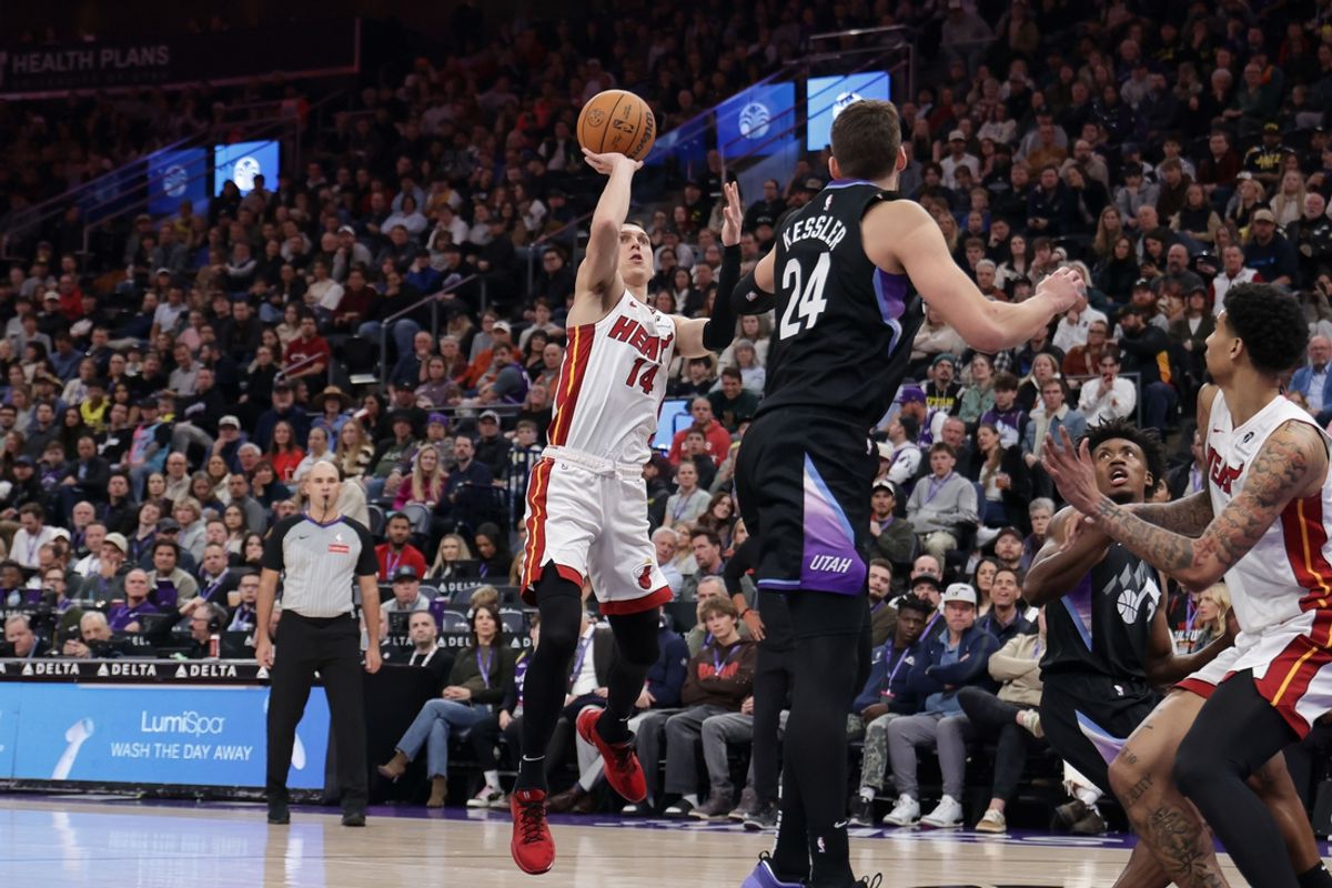 Jan 9, 2025; Salt Lake City, Utah, USA;  Miami Heat guard Tyler Herro (14) shoots the ball over Utah Jazz center Walker Kessler (24) during the second quarter at Delta Center. Mandatory Credit: Chris Nicoll-Imagn Images