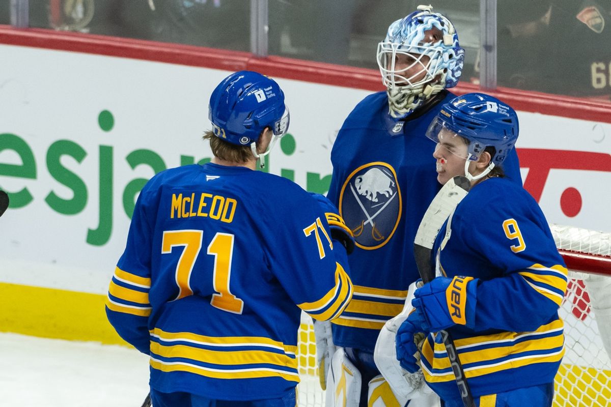 Jan 9, 2025; Ottawa, Ontario, CAN; Buffalo Sabres center Ryan McLeod (71) celebrates with goalie Ukko-Pekka Luukkonen (1) and left wing Zach Benson (9) their win against the Ottawa Senators at the Canadian Tire Centre. Mandatory Credit: Marc DesRosiers-Imagn Images