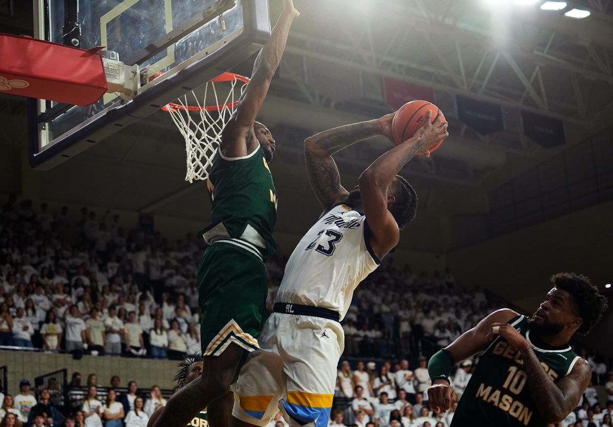 George Mason Patriots guard Jared Billups (1) attempts to block Marquette Golden Eagles forward David Joplin (23) during the first half of the game on Friday November 8 2024 at the Al McGuire Center in Milwaukee, Wis.