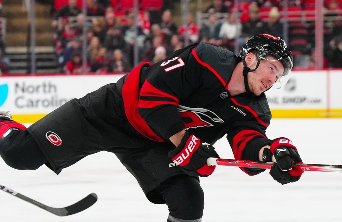 Jan 10, 2025; Raleigh, North Carolina, USA;  Carolina Hurricanes right wing Andrei Svechnikov (37) takes a shot against the Vancouver Canucks during the first period at Lenovo Center. Mandatory Credit: James Guillory-Imagn Images
