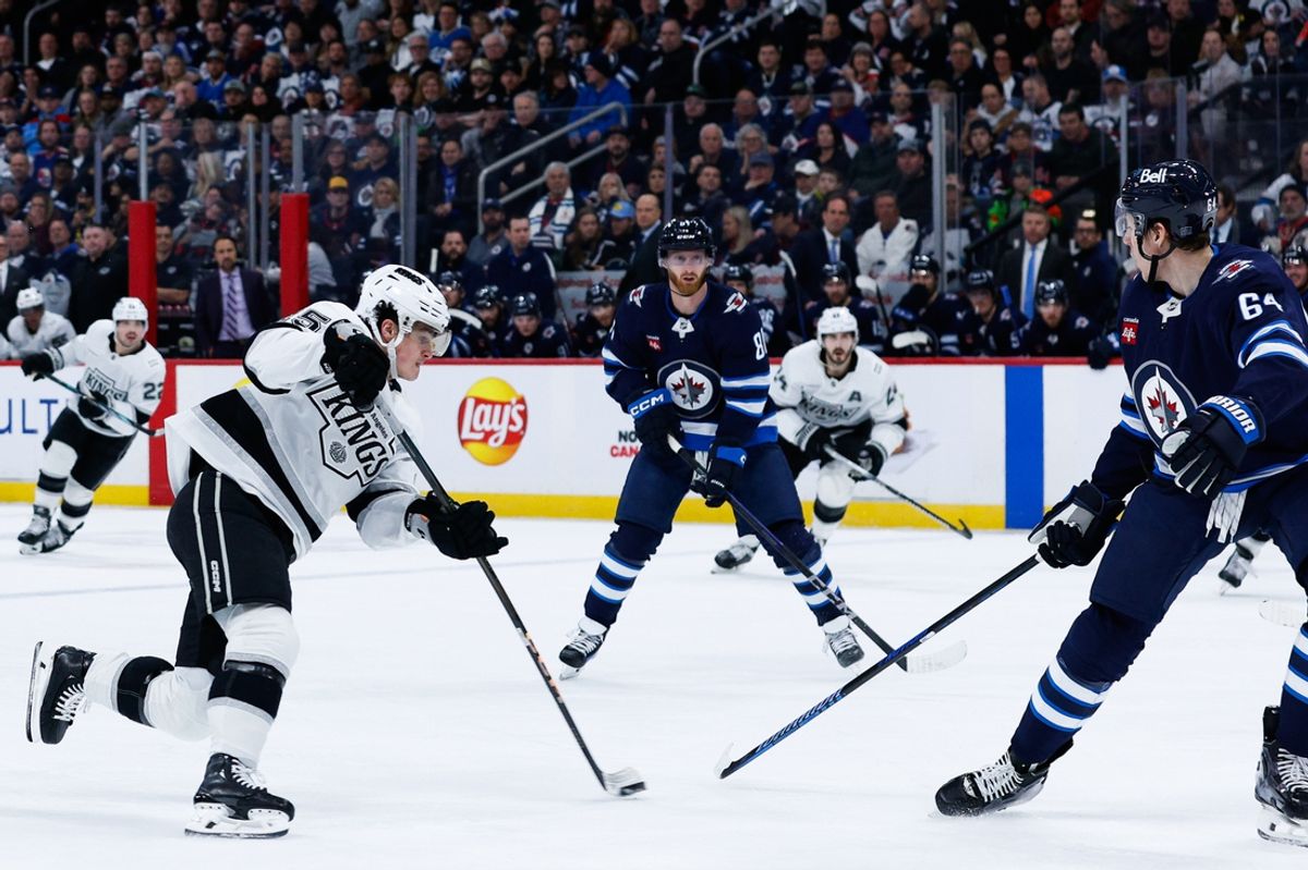 Jan 10, 2025; Winnipeg, Manitoba, CAN; Los Angeles Kings forward Alex Turcotte(15) takes a shot on the Winnipeg Jets net during the first period at Canada Life Centre. Mandatory Credit: Terrence Lee-Imagn Images