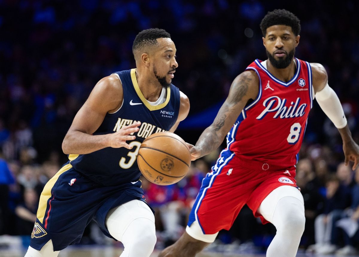 Jan 10, 2025; Philadelphia, Pennsylvania, USA; New Orleans Pelicans guard CJ McCollum (3) dribbles against Philadelphia 76ers forward Paul George (8) during the third quarter at Wells Fargo Center. Mandatory Credit: Bill Streicher-Imagn Images
