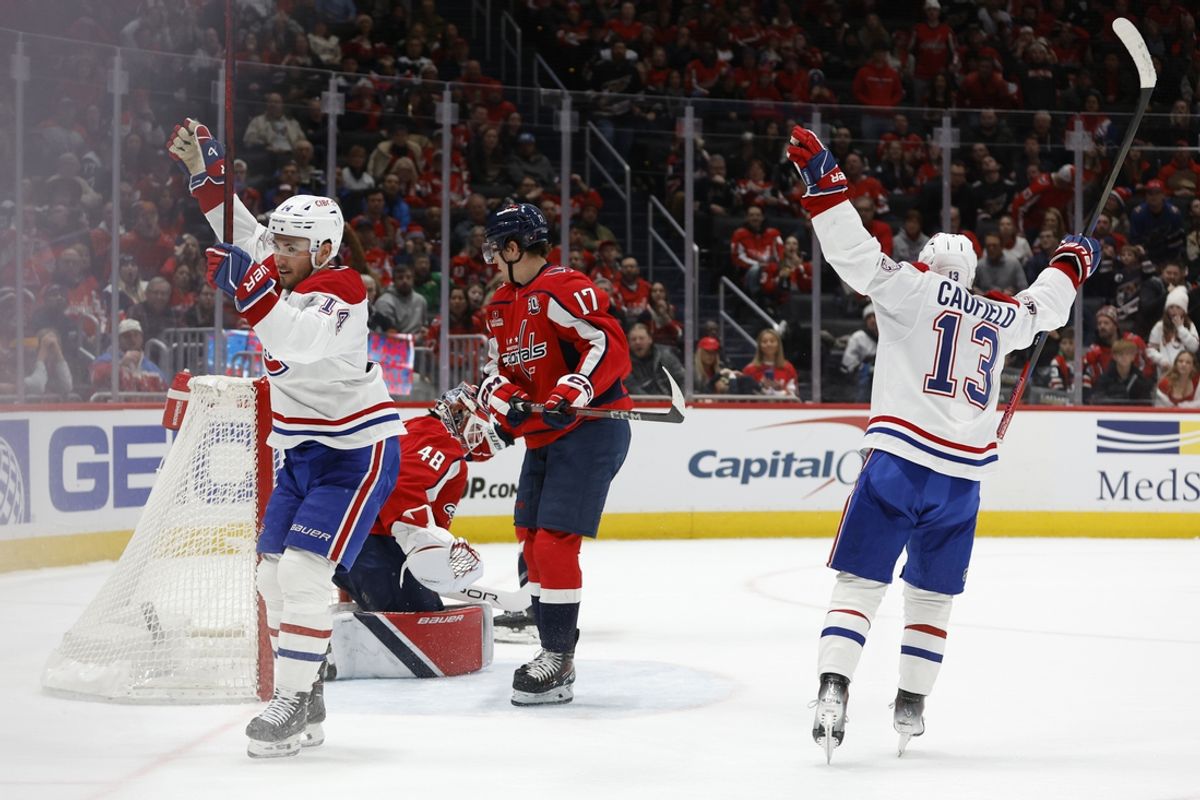 Jan 10, 2025; Washington, District of Columbia, USA; Montreal Canadiens center Nick Suzuki (14) celebrates after scoring the game-winning goal in overtime on Washington Capitals goaltender Logan Thompson (48) at Capital One Arena. Mandatory Credit: Geoff Burke-Imagn Images