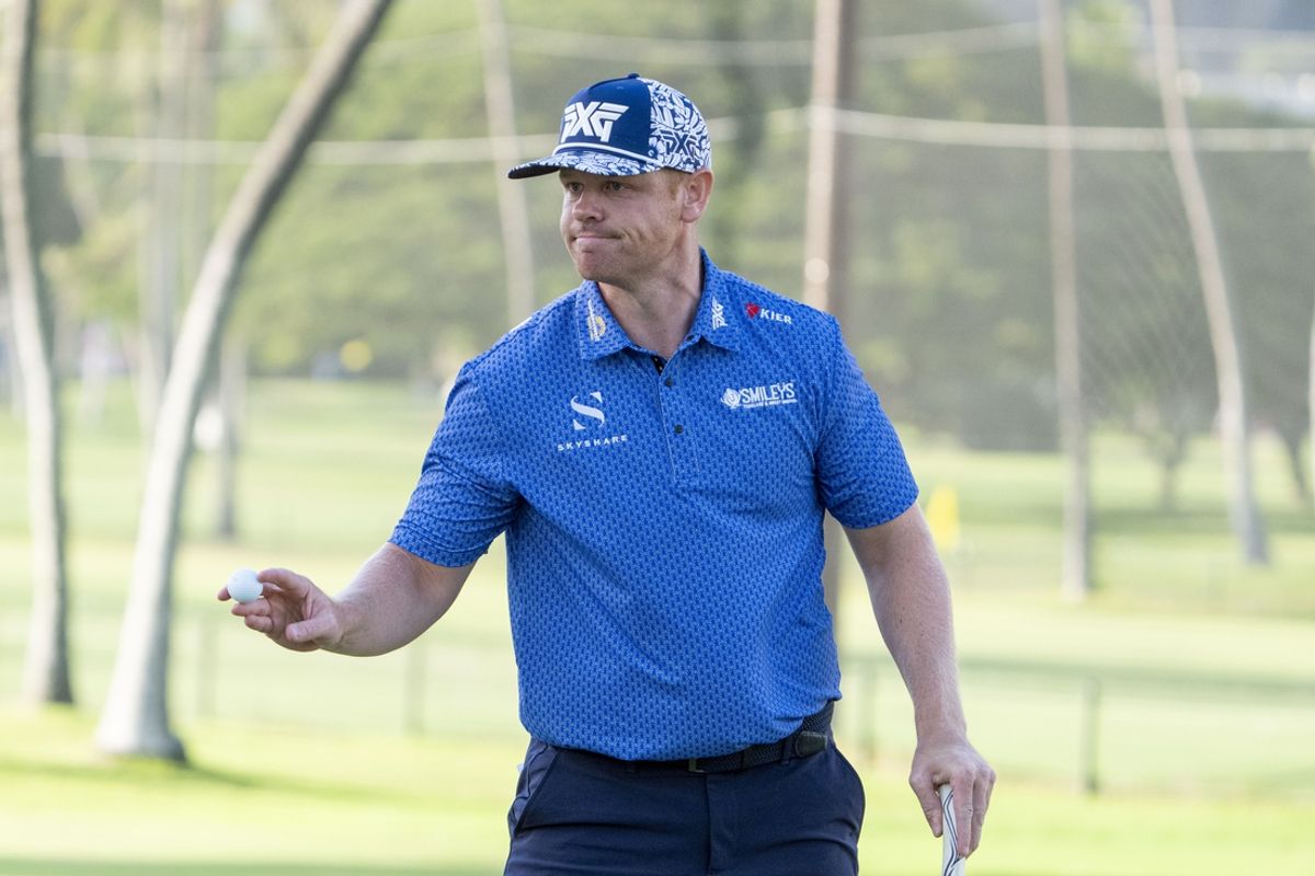 January 10, 2025; Honolulu, Hawaii, USA; Patrick Fishburn acknowledges the crowd after making his putt on the ninth hole during the second round of the Sony Open golf tournament at Waialae Country Club. Mandatory Credit: Kyle Terada-Imagn Images