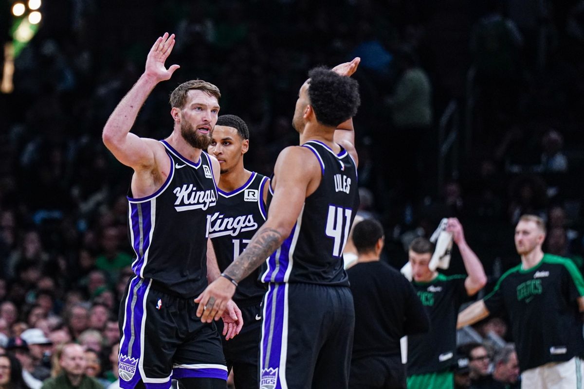 Jan 10, 2025; Boston, Massachusetts, USA; Sacramento Kings forward Domantas Sabonis (11) and forward Trey Lyles (41) react after defeating the Boston Celtics in the second half at TD Garden. Mandatory Credit: David Butler II-Imagn Images
