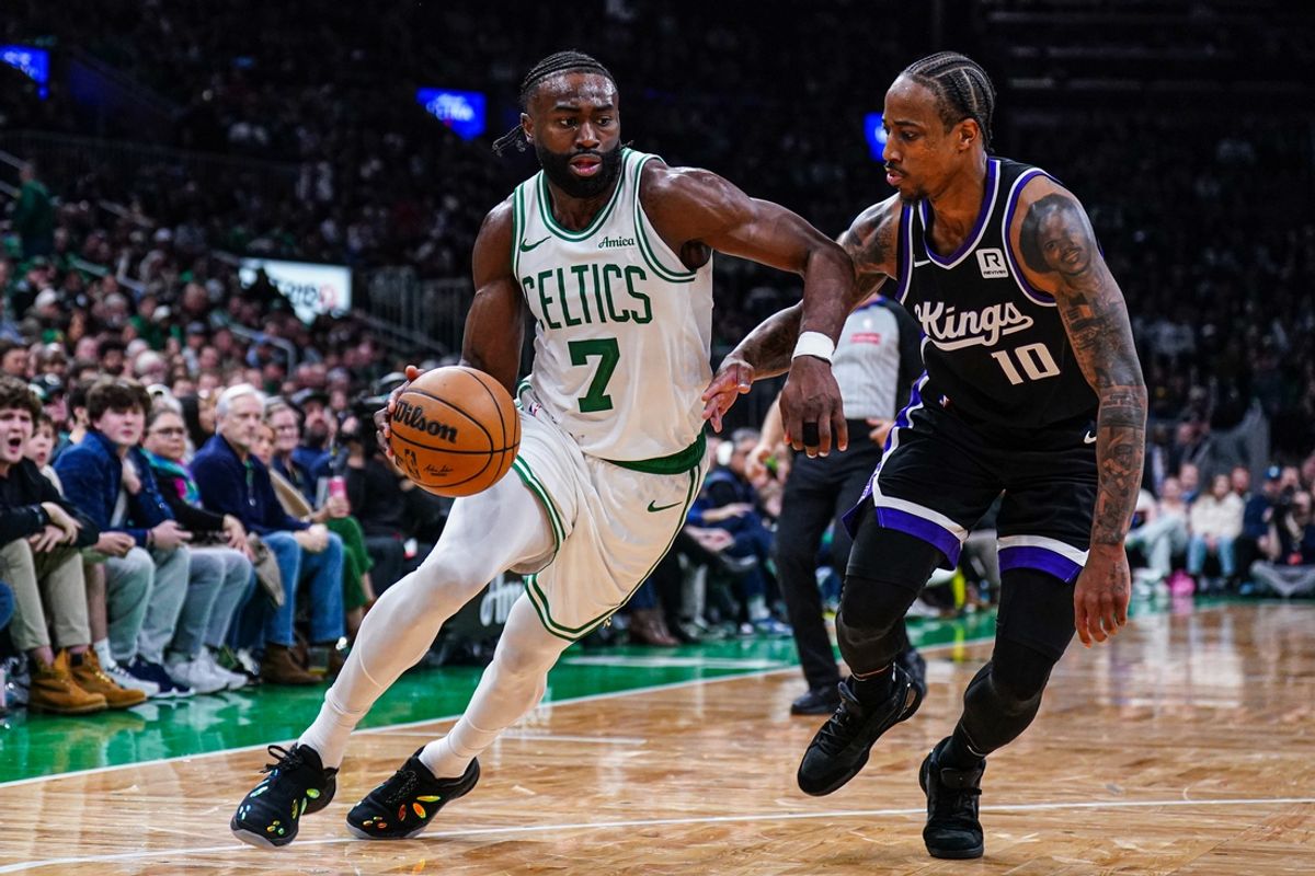 Jan 10, 2025; Boston, Massachusetts, USA; Boston Celtics guard Jaylen Brown (7) drives the ball against Sacramento Kings forward DeMar DeRozan (10) in the second half at TD Garden. Mandatory Credit: David Butler II-Imagn Images