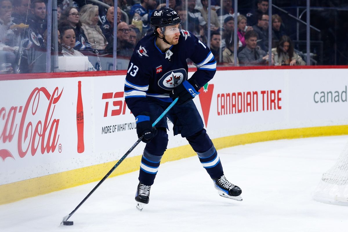 Jan 10, 2025; Winnipeg, Manitoba, CAN; Winnipeg Jets forward Gabriel Vilardi (13) looks to make a pass against the Los Angeles Kings during the second period at Canada Life Centre. Mandatory Credit: Terrence Lee-Imagn Images