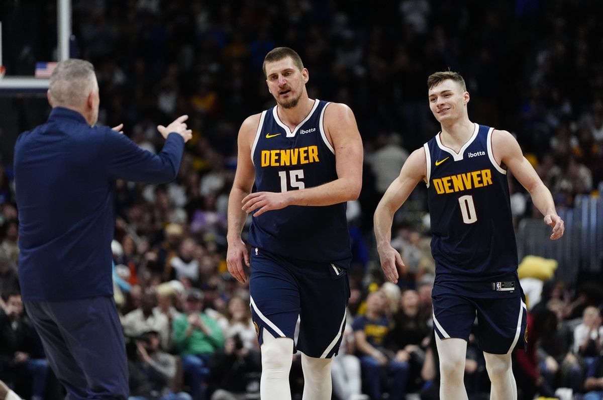 Jan 10, 2025; Denver, Colorado, USA; Denver Nuggets center Nikola Jokic (15) and center Christian Braun (15) walk towards head coach Michael Malone in the second half at Ball Arena. Mandatory Credit: Ron Chenoy-Imagn Images