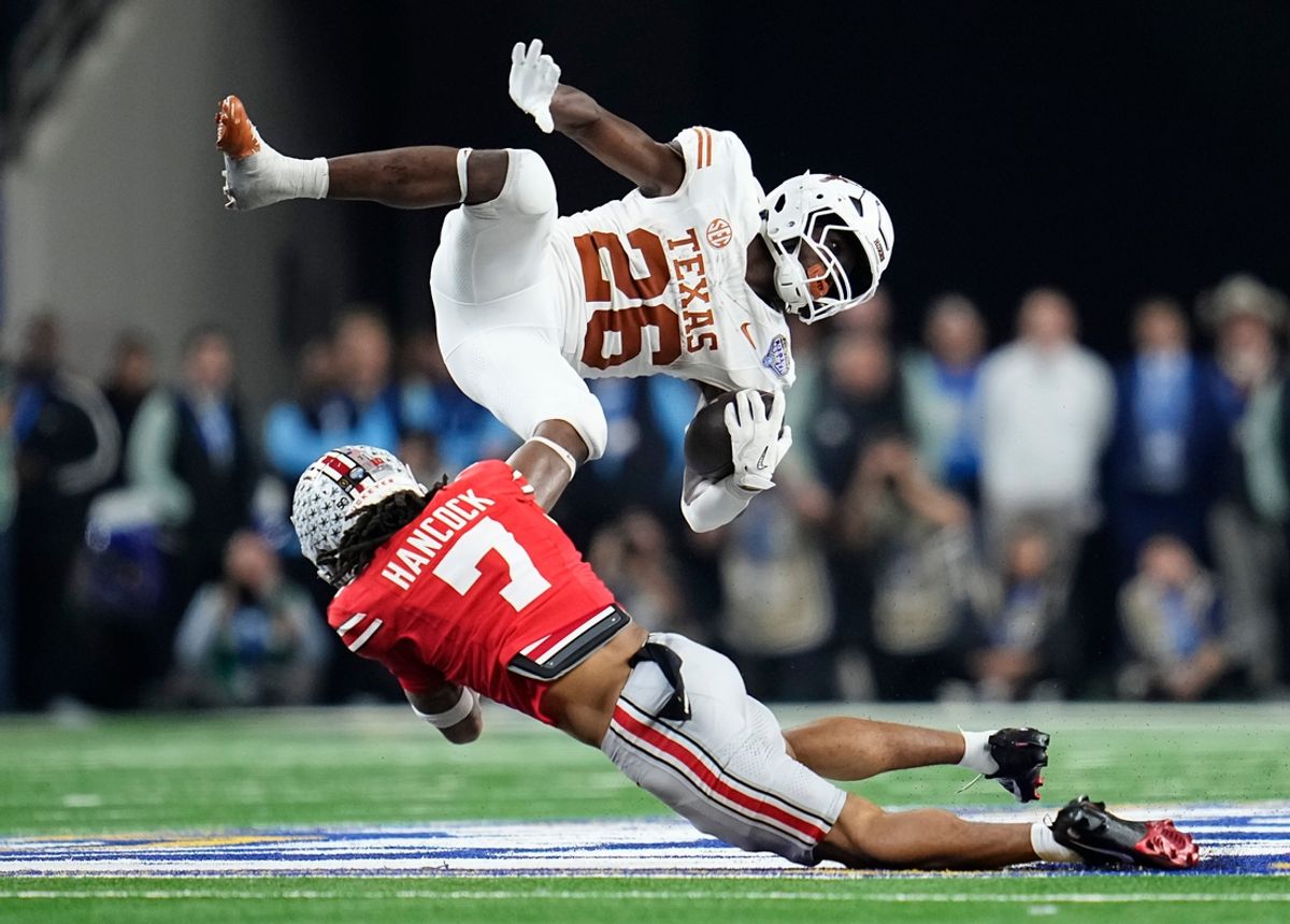 Ohio State Buckeyes cornerback Jordan Hancock (7) tackles Texas Longhorns running back Quintrevion Wisner (26) during the second half of the Cotton Bowl Classic College Football Playoff semifinal game at AT&T Stadium in Arlington, Texas on Jan. 10, 2025. Ohio State won 28-14.