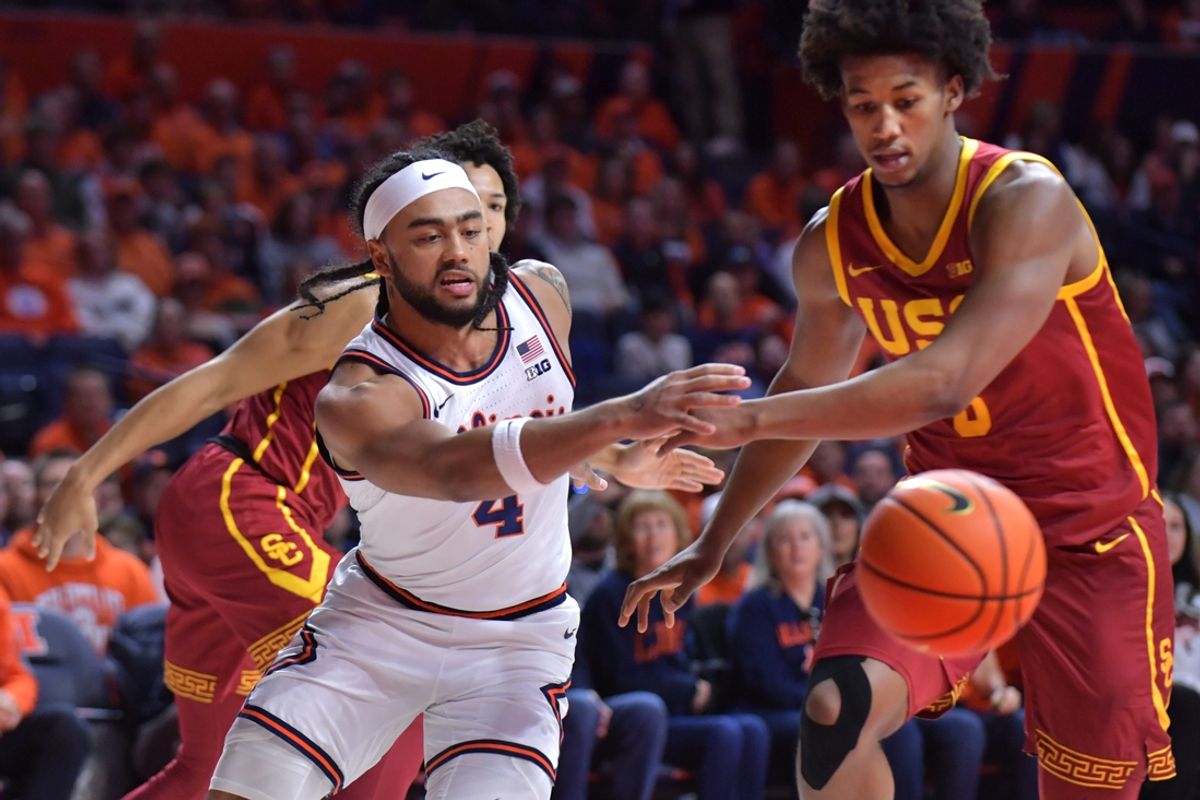 Jan 11, 2025; Champaign, Illinois, USA;  Illinois Fighting Illini guard Kylan Boswell (4) and USC Trojans guard Wesley Yates III (6) vie for the ball during the first half at State Farm Center. M andatory Credit: Ron Johnson-Imagn Images
