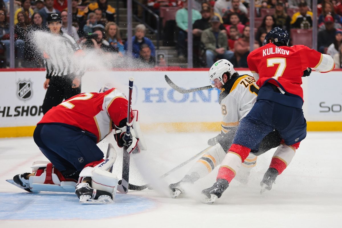 Jan 11, 2025; Sunrise, Florida, USA; Boston Bruins center Pavel Zacha (18) shoots the puck against Florida Panthers goaltender Sergei Bobrovsky (72) during the first period at Amerant Bank Arena. Mandatory Credit: Sam Navarro-Imagn Images
