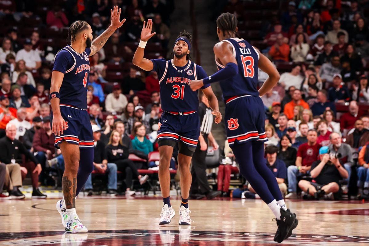 Jan 11, 2025; Columbia, South Carolina, USA; Auburn Tigers forward Chaney Johnson (31) and forward Johni Broome (4) celebrate a play against the South Carolina Gamecocks in the first half at Colonial Life Arena. Mandatory Credit: Jeff Blake-Imagn Images