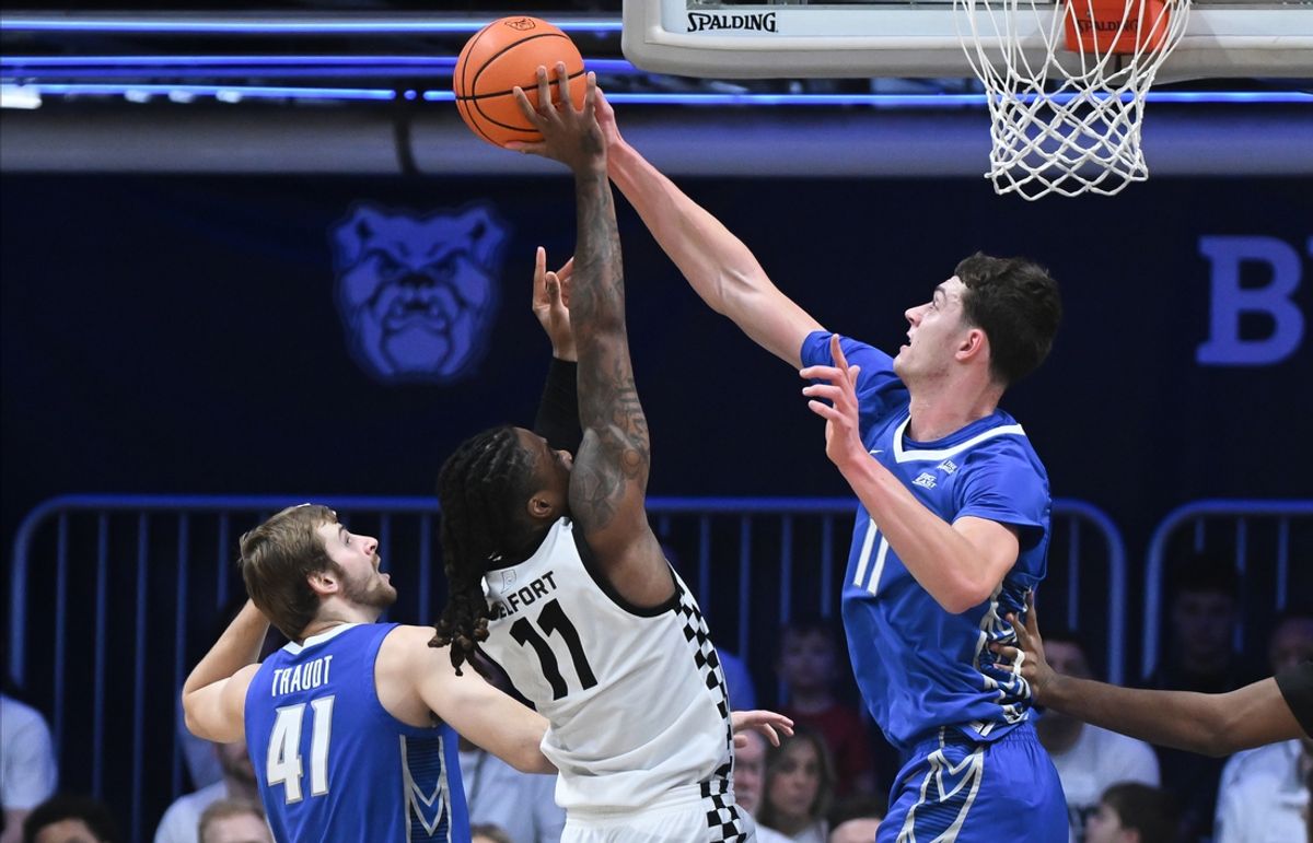 Jan 11, 2025; Indianapolis, Indiana, USA; Creighton Bluejays center Ryan Kalkbrenner (11) blocks a shot attempt from Butler Bulldogs forward Jahmyl Telfort (11) during the second half at Hinkle Fieldhouse. Mandatory Credit: Robert Goddin-Imagn Images
