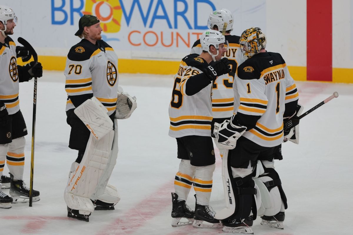 Jan 11, 2025; Sunrise, Florida, USA; Boston Bruins goaltender Jeremy Swayman (1) celebrates with teammates after the game against the Florida Panthers at Amerant Bank Arena. Mandatory Credit: Sam Navarro-Imagn Images