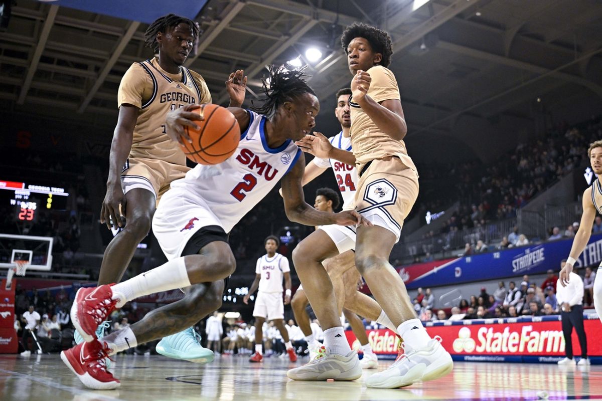 Jan 11, 2025; Dallas, Texas, USA; SMU SMU Mustangs guard Boopie Miller (2) controls the ball under the basket during the first half against the Georgia Tech Yellow Jackets at Moody Coliseum. Mandatory Credit: Jerome Miron-Imagn Images