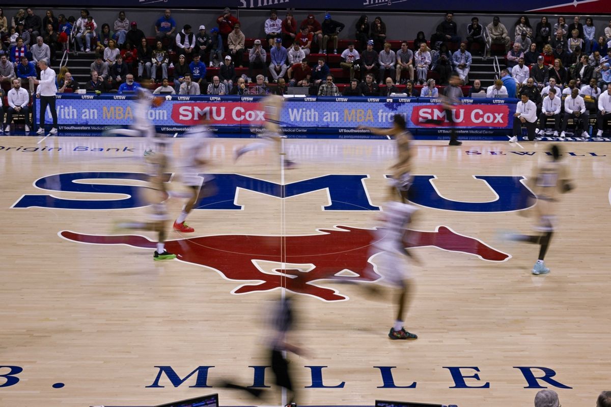 Jan 11, 2025; Dallas, Texas, USA; (editor’s note, in camera motion blur) A view of the SMU Mustangs logo during the first half of the game between the SMU Mustangs and the Georgia Tech Yellow Jackets at Moody Coliseum. Mandatory Credit: Jerome Miron-Imagn Images